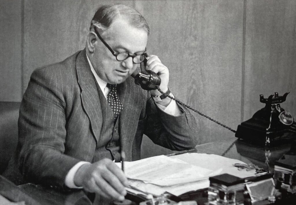 Ernest Hives, later Lord Hives, at his desk